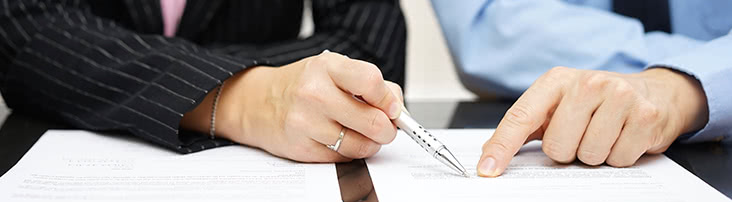 Two people looking at a document