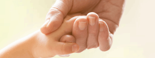 grandparent holding child's hand