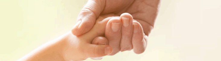 grandparent holding child's hand