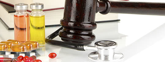 gavel, pills and stethoscope