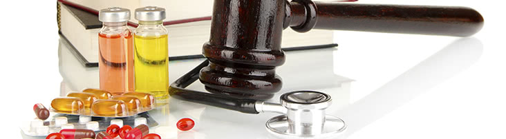 gavel, pills and stethoscope