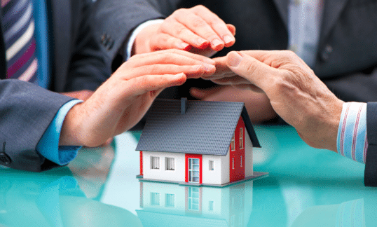 Lawyers negotiating over a model of a matrimonial home