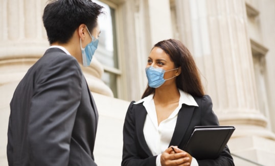 two lawyers wearing masks