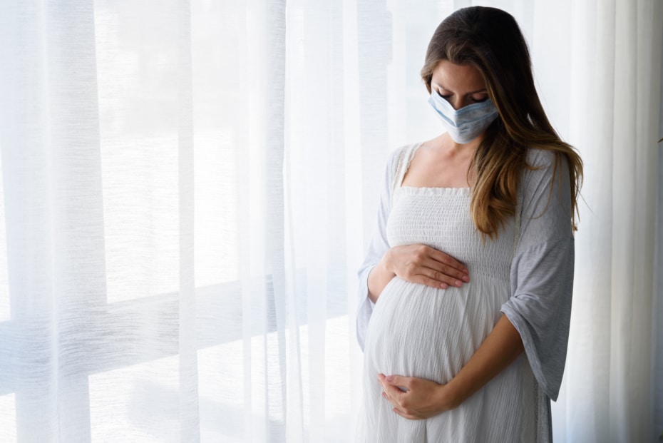 Pregnant woman with mask on