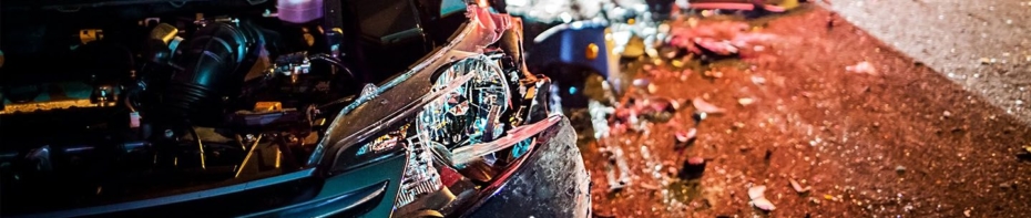 Close up image of smashed head light following an auto accident.