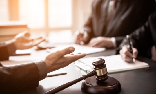 Lawyers in a meeting with a gavel