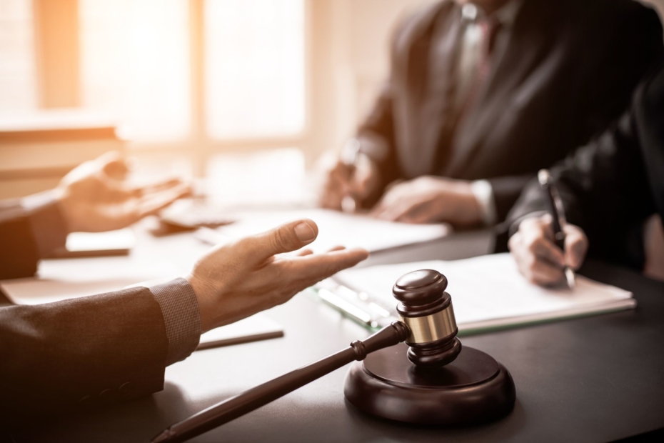 Lawyers in a meeting with a gavel