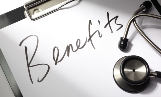 "Benefits" written on a doctor's clipboard with stethoscope.