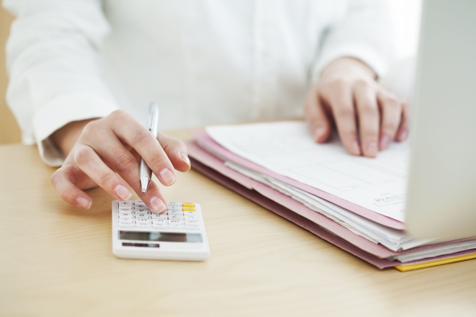 businesswoman working on pile of papers