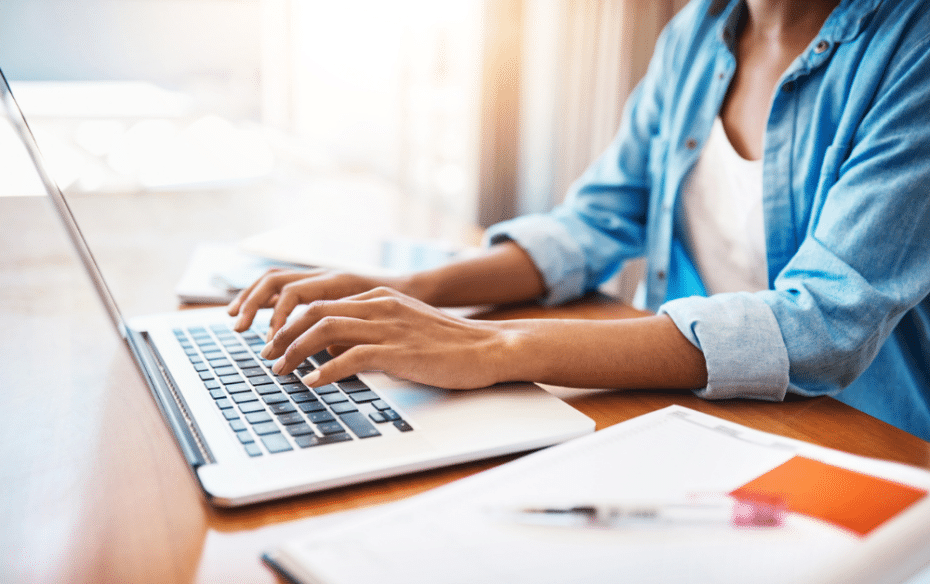 A woman using a laptop to access Settify, a family law service