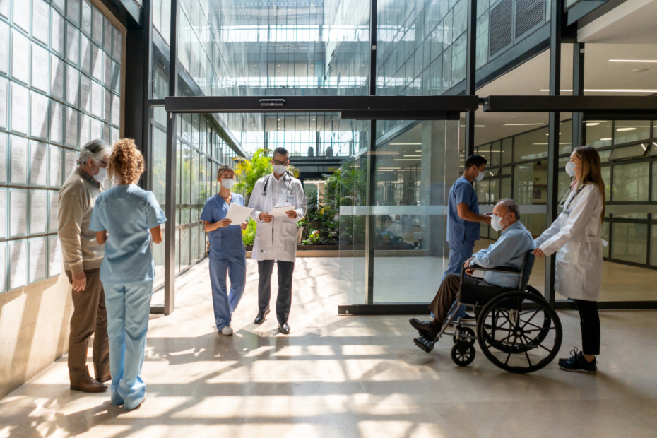 People walking in and out of the hospital - Mental Healthcare concepts