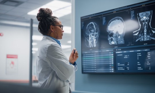 Female doctor looking at brain scans MRI