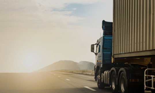 Transport Truck driving on busy highway